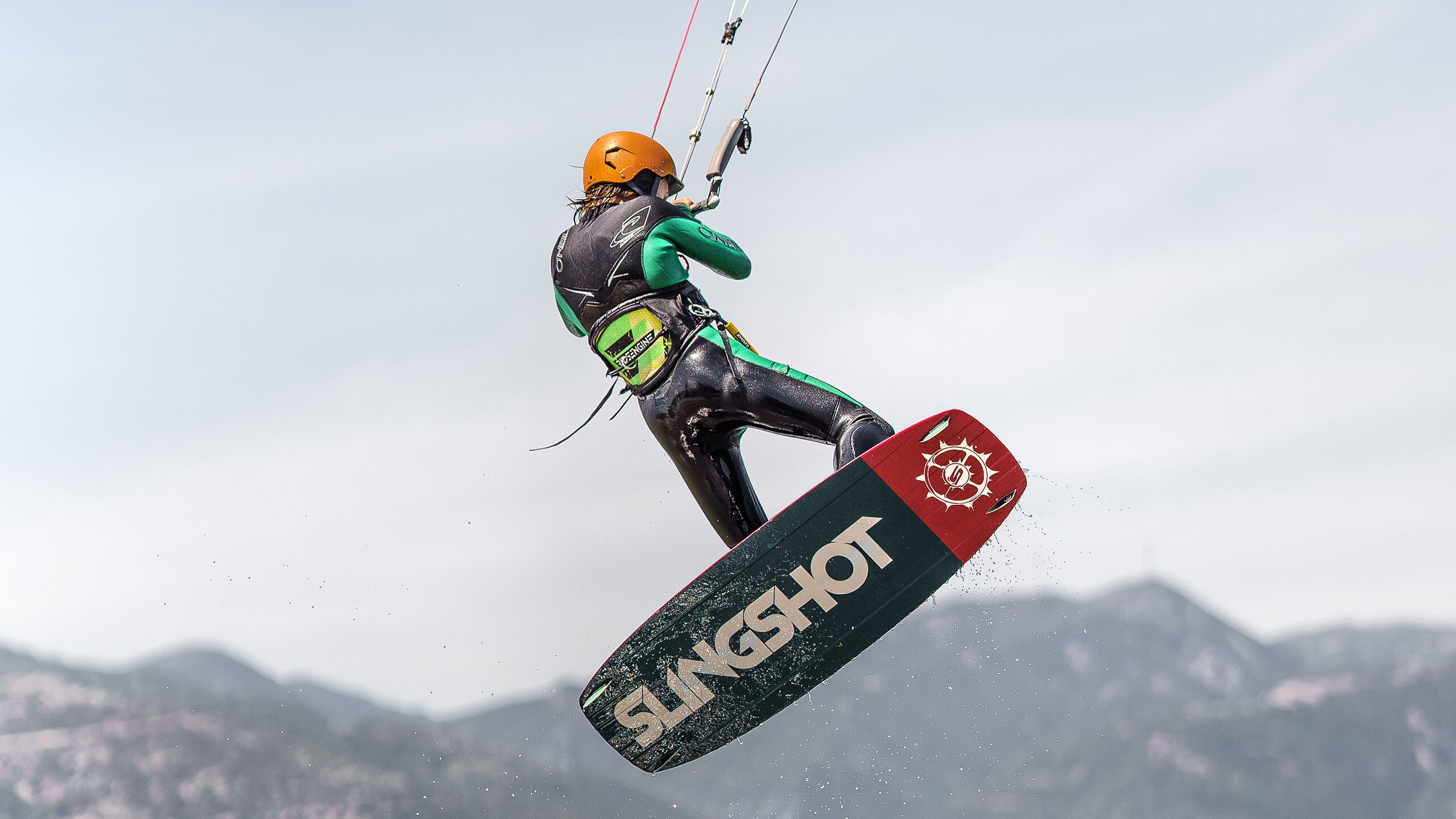 Flying over the water on a kitesurf